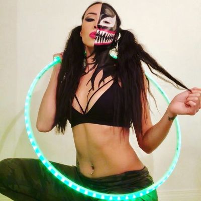 Picture of Meika SIla with her half painted face and light ring.